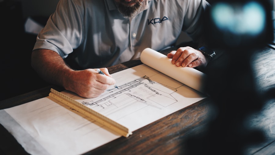 Reviewing architectural plans and documentation on a desk